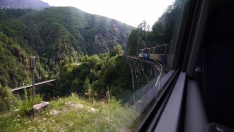 centovalli railway locarno-domodossola train crossing bridge. ticino switzerland.