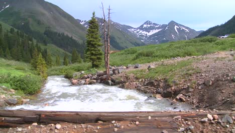 Rocky-Mountain-river-and-mountains-from-a-bridge