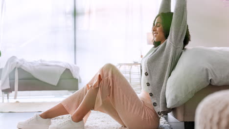 relax, happy and stretching woman sitting at home