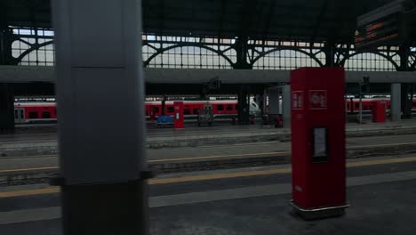 passengers and trains at cuneo station platform