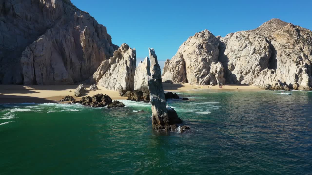 Drone footage of Lands End and the iconic Arch in Cabo San Lucas, Baja California Sur, Mexico showcasing the dramatic rock formations, crystal-clear waters of the Pacific Ocean