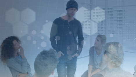 animation of hexagons over diverse people participating in group therapy