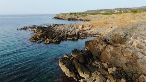 Rocky-Coast-on-Ocean-Landscape-in-Crete,-Greece,-Aerial-Drone