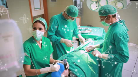 animación de moléculas sobre cirujanos caucásicos con máscaras faciales durante la cirugía