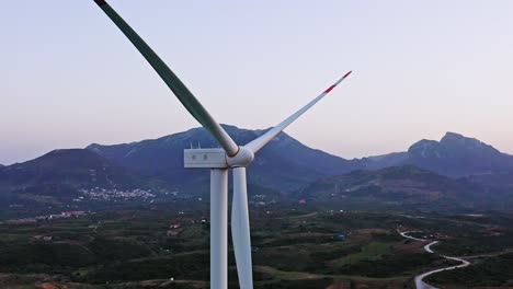 Zoom-footage-of-wind-turbine-at-Aegean-Turkey,-Datça-peninsula,-evening-dusk-setting