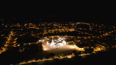 Beautiful white church in El Rocio, at night. Aerial Drone