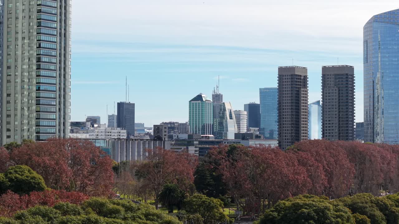 Low-angle drone fly at Puerto Madero capital city skyline with high-rise buildings in autumn environment, Buenos Aires, Argentina