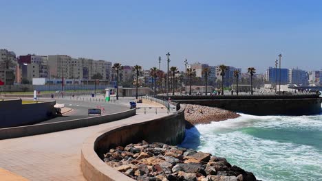 Casablanca-coast,-ocean-waves-on-rocky-beach,-Morocco-sea-wall