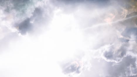 a thunderstorm with a flash of lightning inside the cumulus cloud