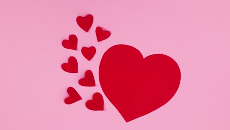 big red heart and little hearts appear on pink theme. stop motion valentine's day