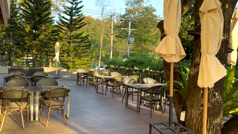 empty restaurant patio with tables and chairs