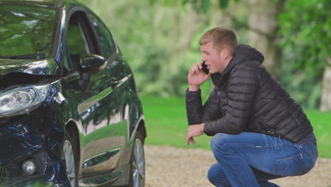 Teenage-Driver-Gets-Out-Of-Smoking-Car-And-Checks-Accident-Damage-Before-Calling-Emergency-Services