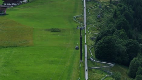 cable lift transporting occupants up and down countryside slope