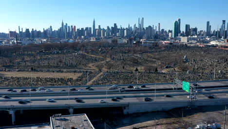 an aerial time lapse over warehouses by a highway