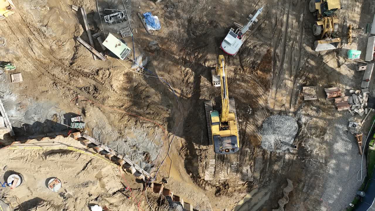 Aerial View of a Construction Site with Excavators and Heavy Machinery