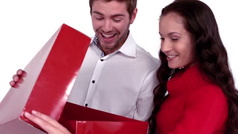 happy couple opening gift together