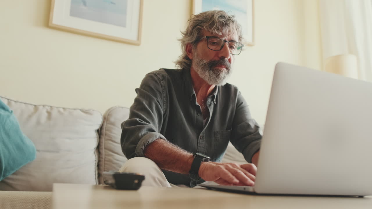 Man working on laptop at home