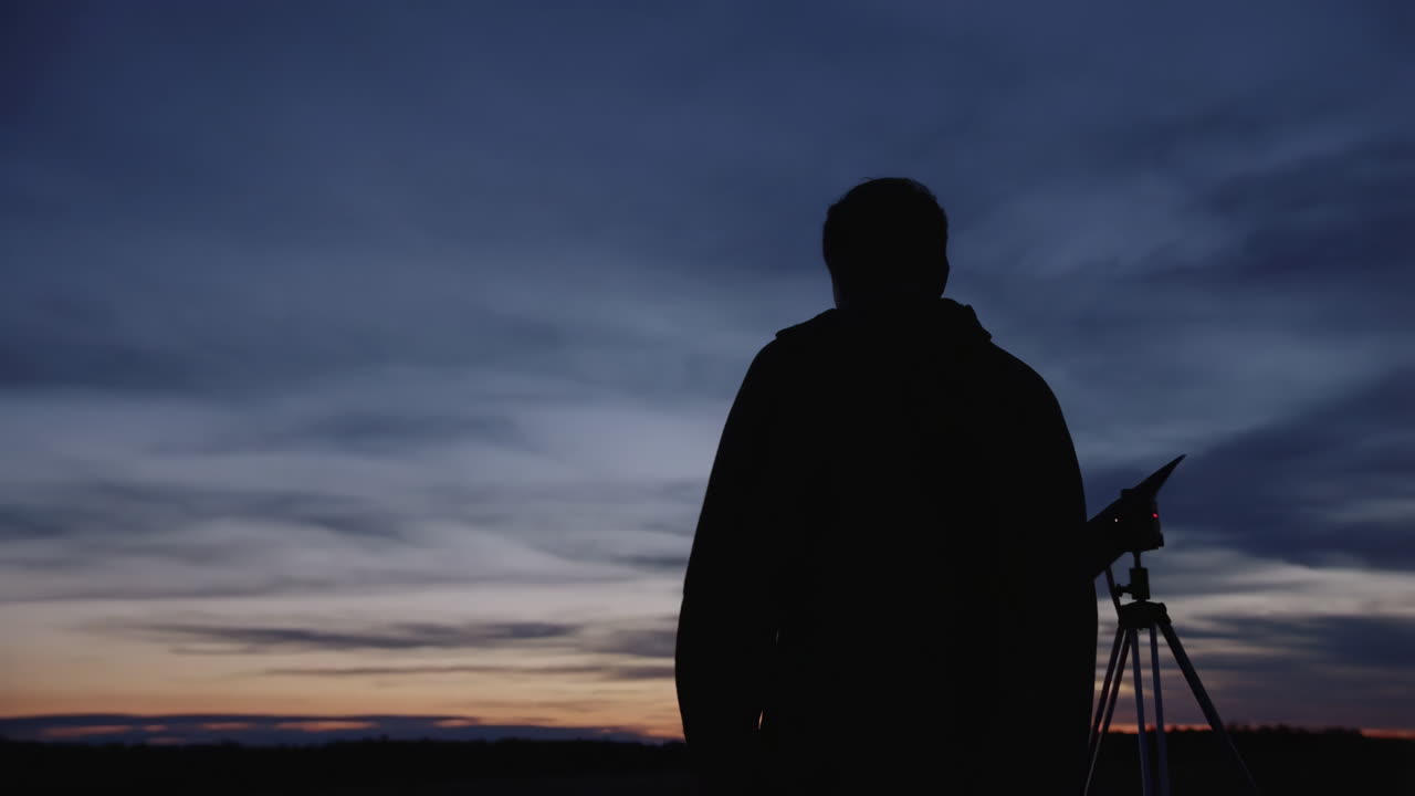 Silhouette of a photographer at sunset