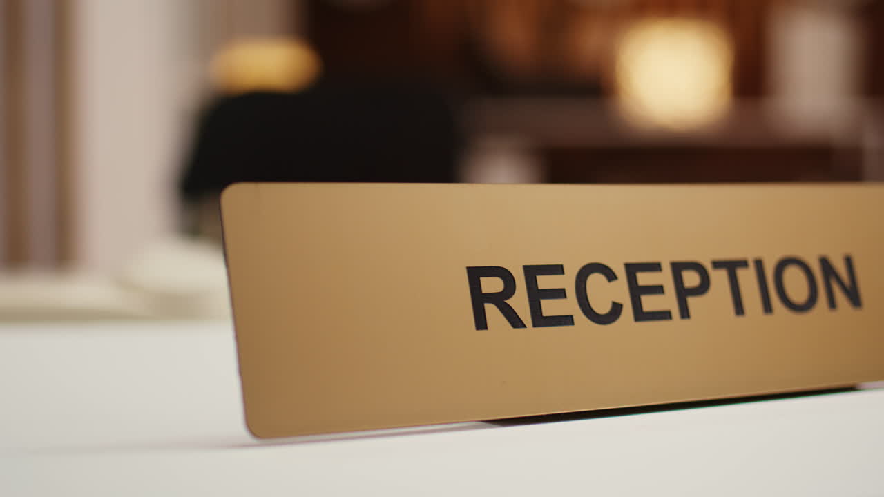 Extreme close up of hotel reception sign