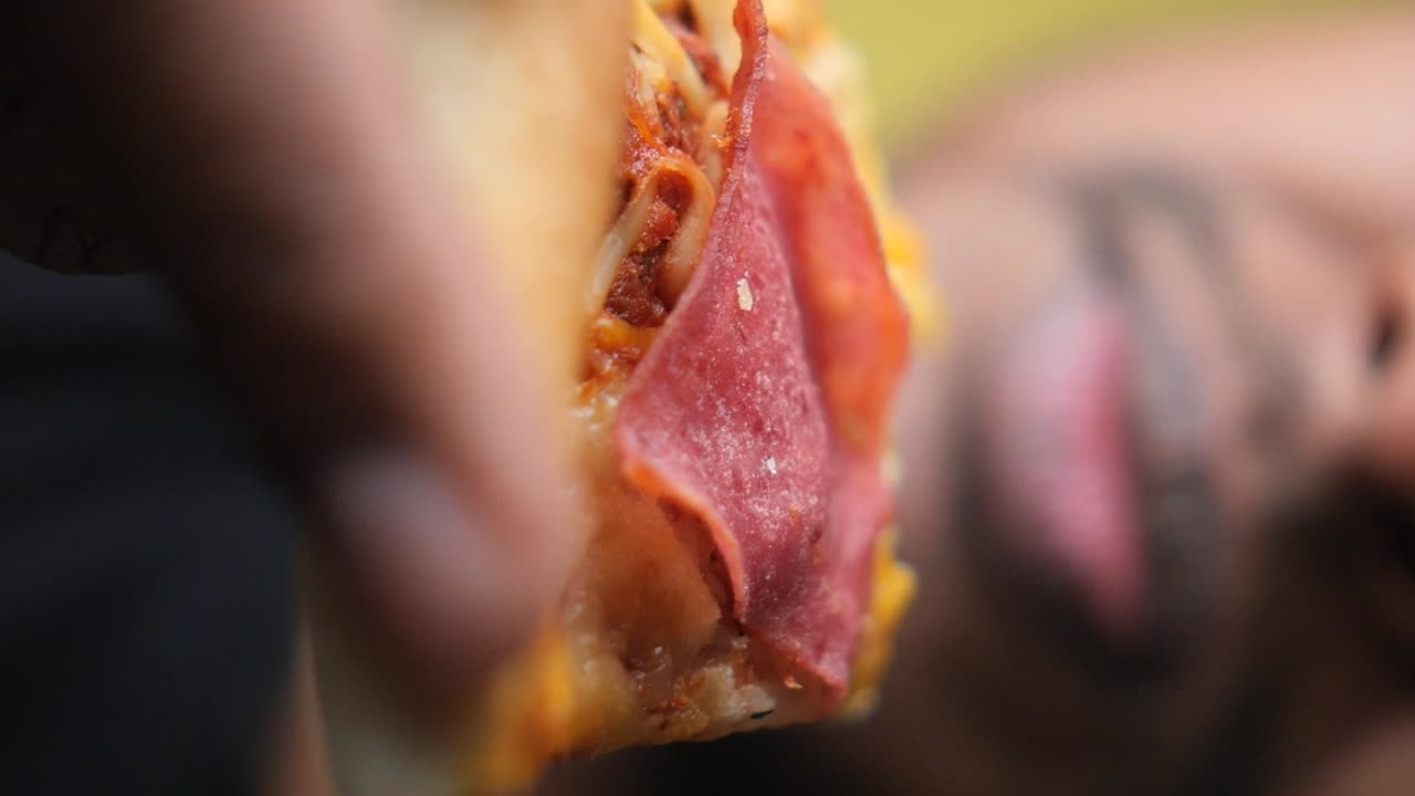 Pizza slice with salami