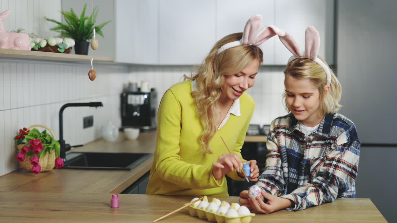 Mother and Daughter Painting Easter Eggs Together