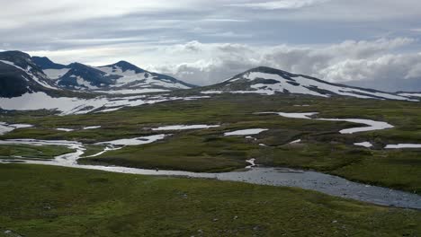 River-flow-through-a-valley-of-Mount-Sylarna