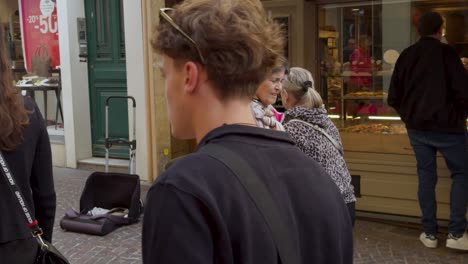 street musician playing accordion in old town of antibes, france. slow motion shot