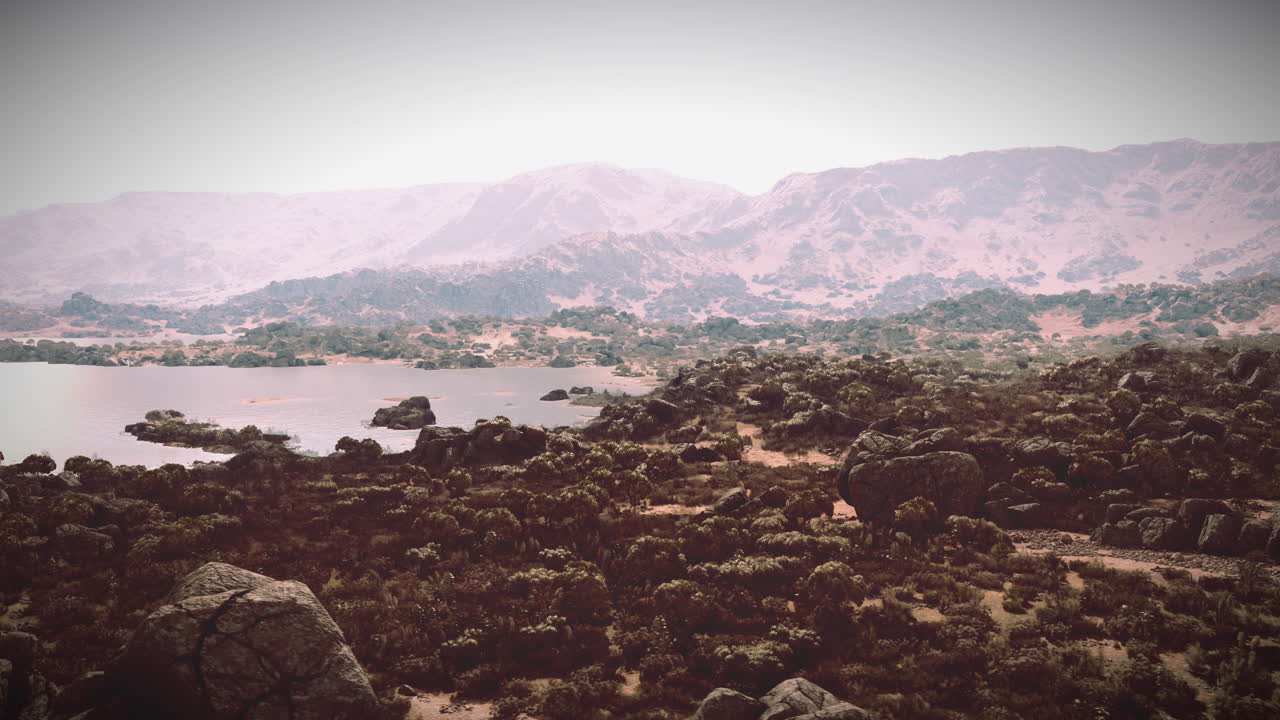 paisaje desértico sereno con montañas y lagos