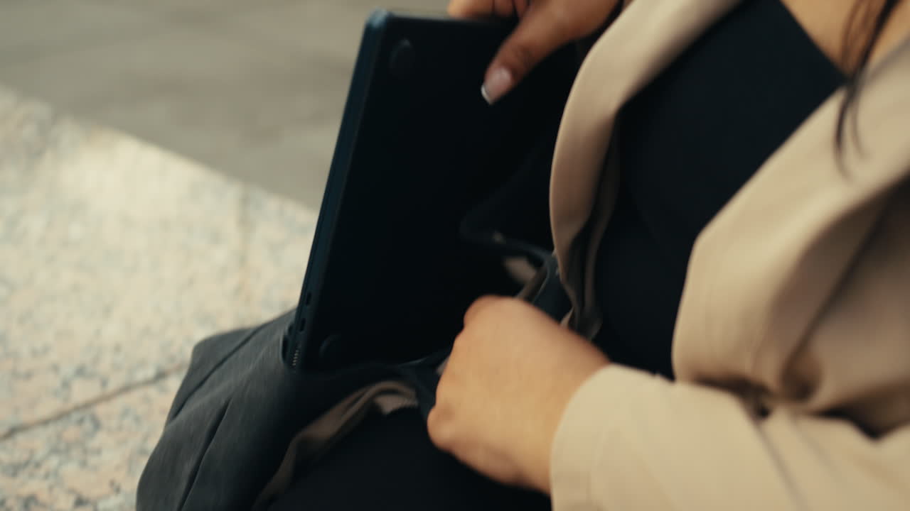 Woman with laptop and bag