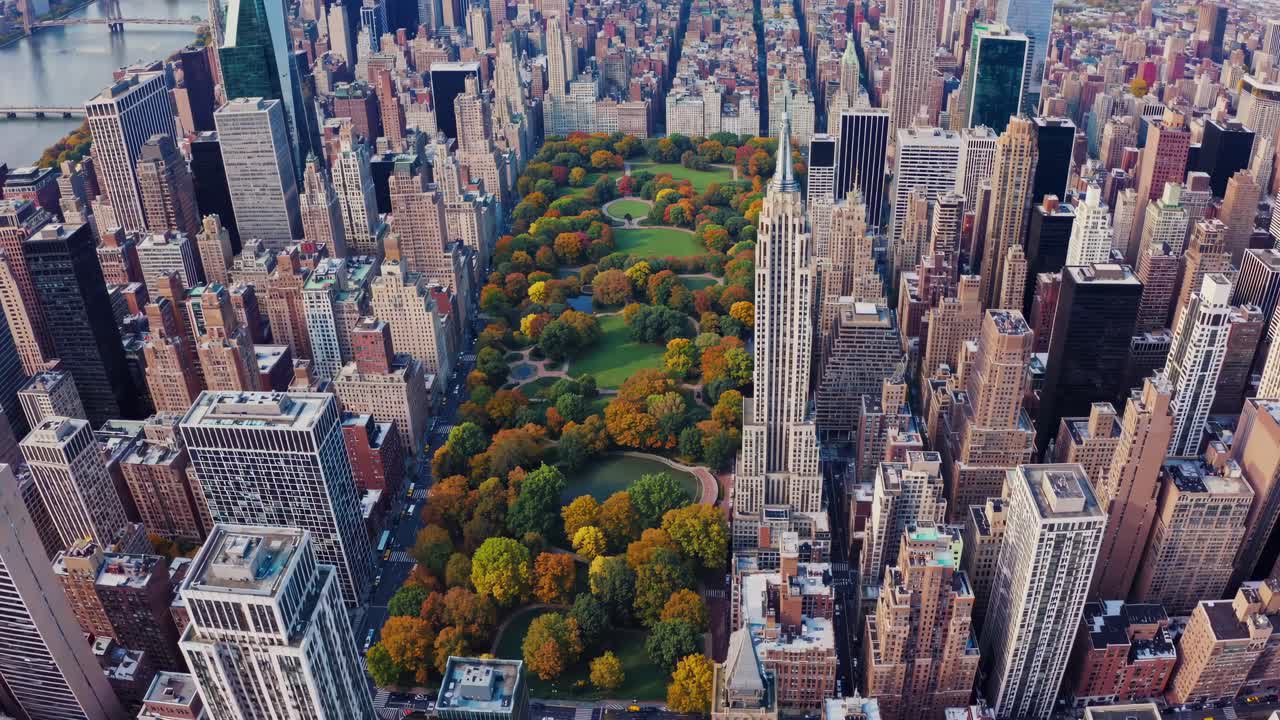 Aerial video capturing a stunning top-down view of a cityscape with a central park, showcasing urban