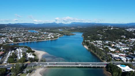 high scenic panorama of tallebudgera creek bridge with the gold coast hinterland in the foreground