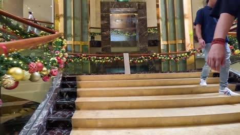 couple dancing down a decorated staircase.