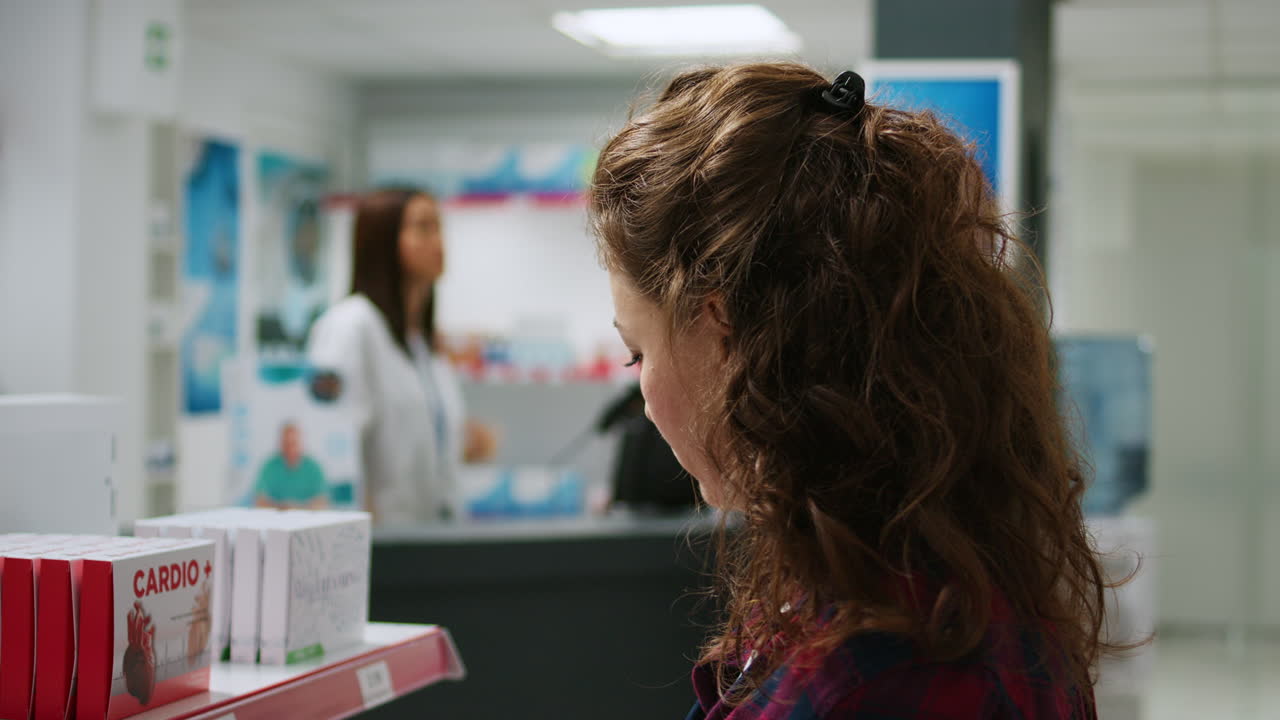 Customers shopping for medicine at the pharmacy