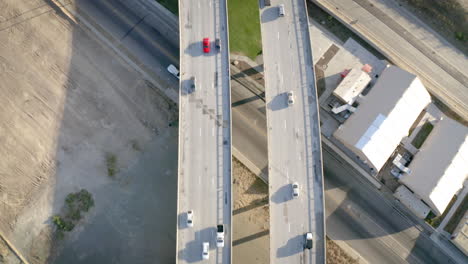 aerial top-down view of cars driving on a highway overpass