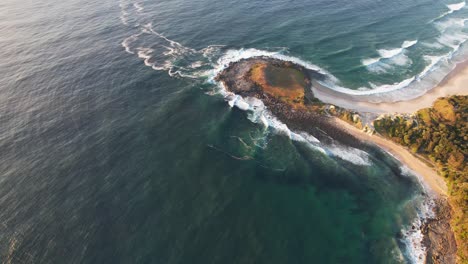 angourie point beach with angourie blue pool in nsw, australia - aerial drone shot