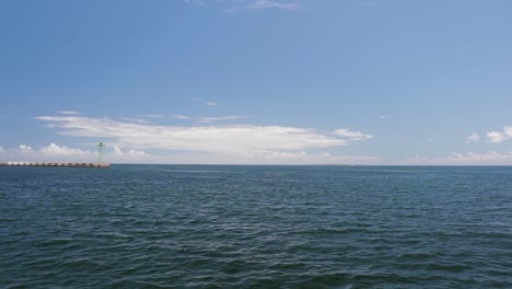 a crabing shot from the side of a catamaran leaving the v-a waterfront in cape town, south africa
