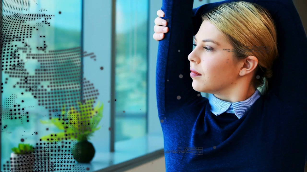 Woman stretching after typing on laptop for short break, tech globe and code floating around her