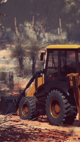 yellow backhoe in the australian outback