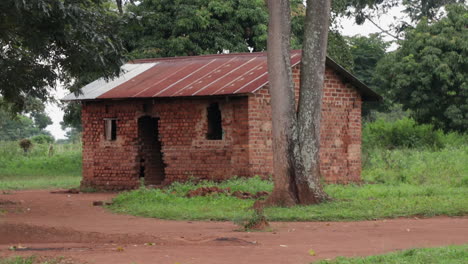 redbrick home in rural area of uganda, africa