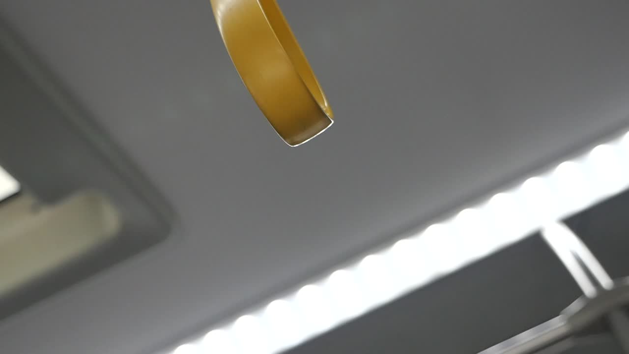Yellow Grab Handle in Public Transport