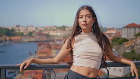 confident woman posing cityscape vacation portrait. a girl looking camera