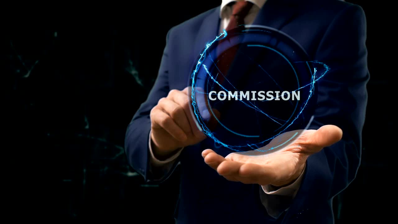 Businessman shows concept hologram gold Bitcoin on his hand