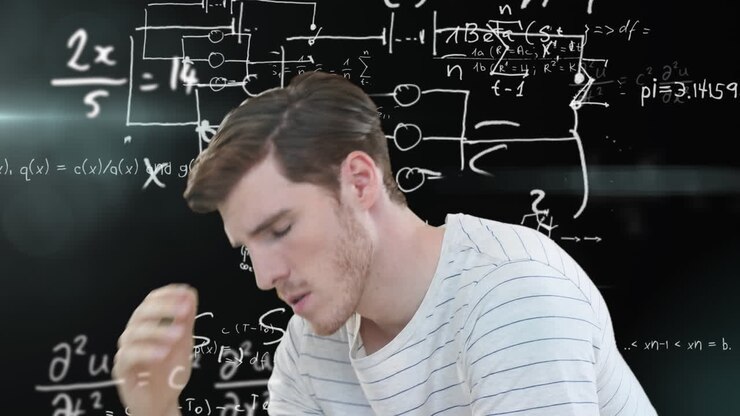 Uomo che pensa su equazioni matematiche
