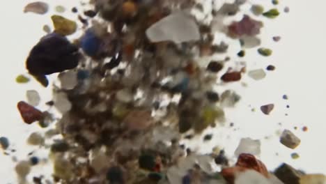 a dynamic explosion of colorful granules: discovering the beauty in various particles captured in motion