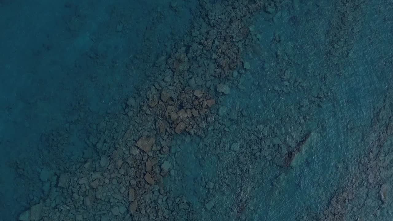 Aerial view of rocky coastline in Greece on a clear day