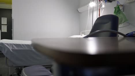revealing shot in hospital empty room table bed and chair in madrid puerta de hierro