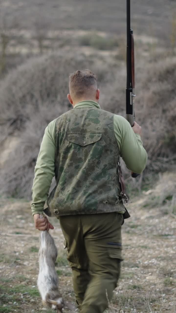 Hunter with Shotgun and Rabbit