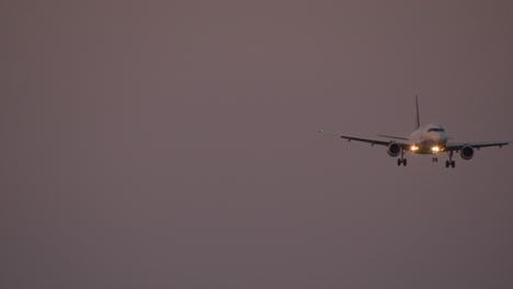 airplane landing at dusk