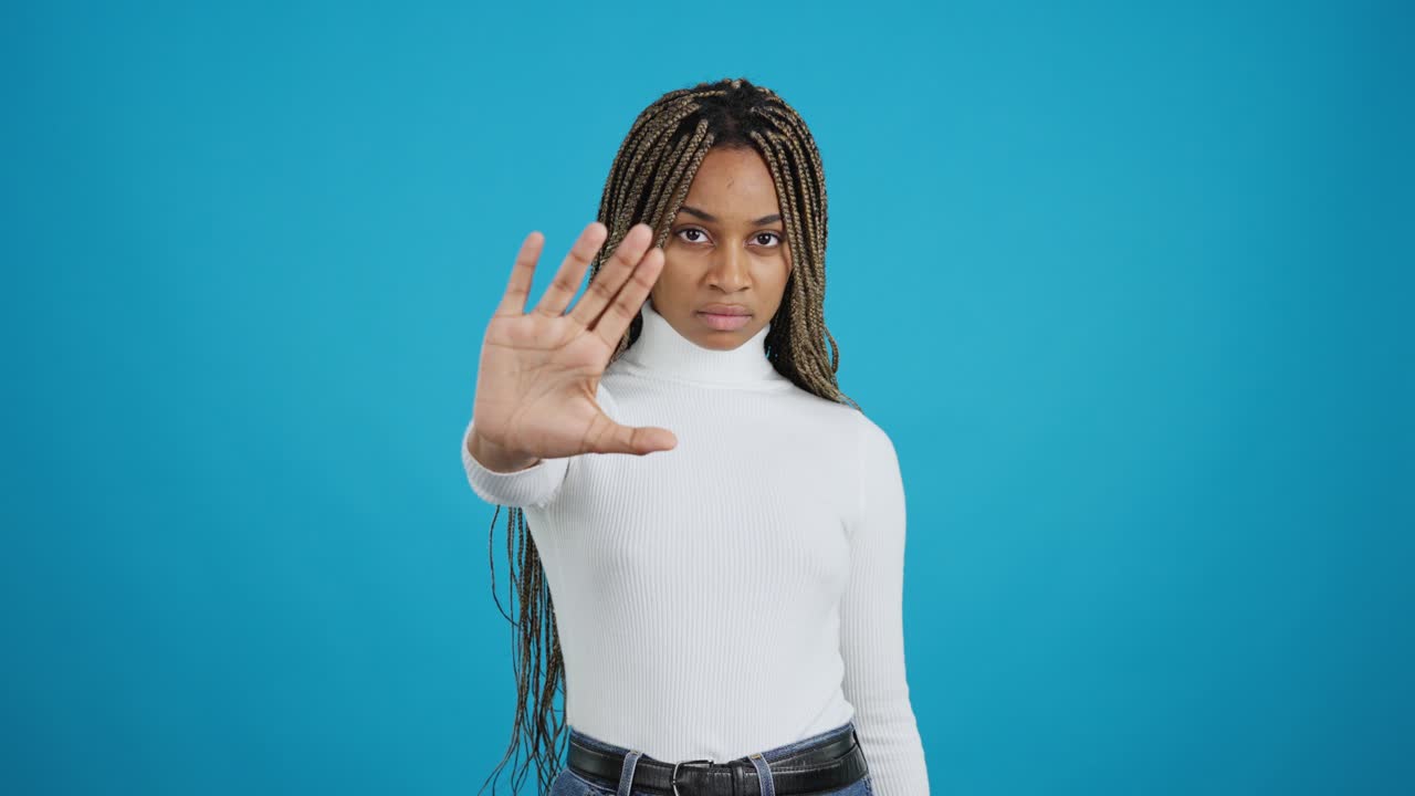 Serious woman making a stop gesture