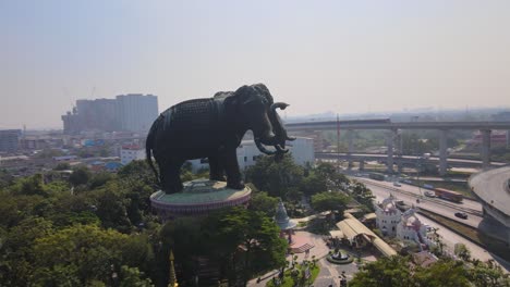 4k-Aerial-panning-left-to-right-Erawan-museum-and-a-road-junction-in-Samut-Prakan-Province,-Bangkok,-Thailand